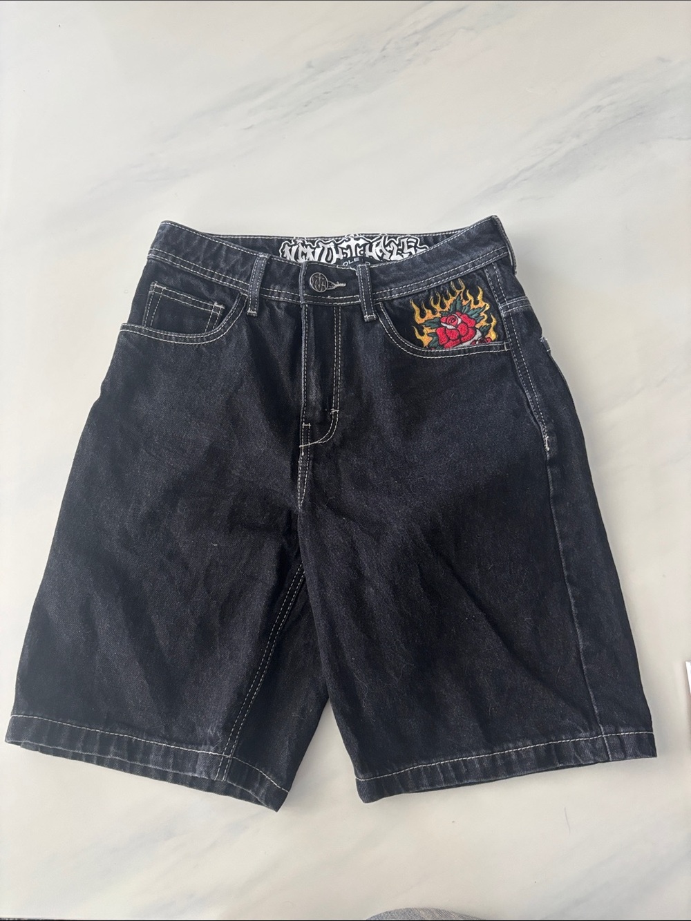 Black denim NinthHall jorts lots of embroidery on front and back